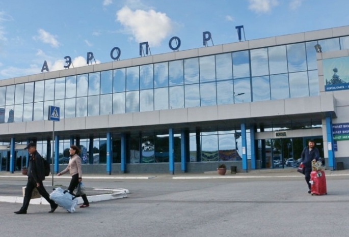 Сколько аэропортов в омске. Аэропорт ОАО «Омский аэропорт». Аэропорт имени Карбышева. Омский аэропорт лого. Омский аэропорт 1989г.
